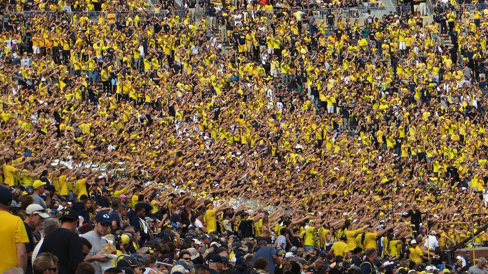 A packed college football student section, reflecting the scale of college athletics content and NIL activity